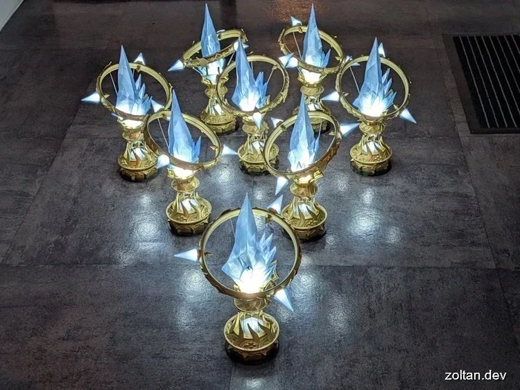 10 3D printed Aetheryte Crystals against a dark floor, each topped with a glowing blue crystal.