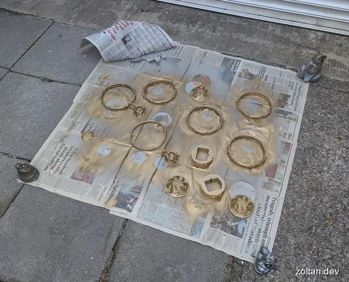Several 3D printed pieces of the Aetheryte Crystal being spraypainted.