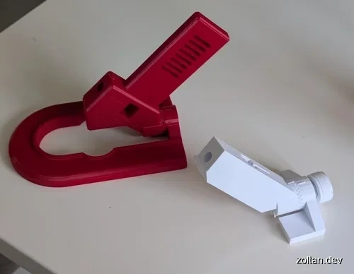 Two 3D-printed tools for holding utility blades.