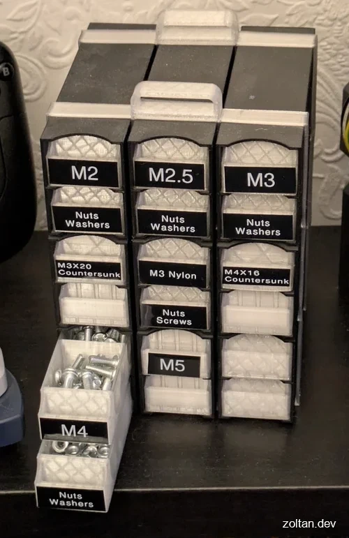 Organized storage unit for screws and washers in various sizes (M2 to M5).