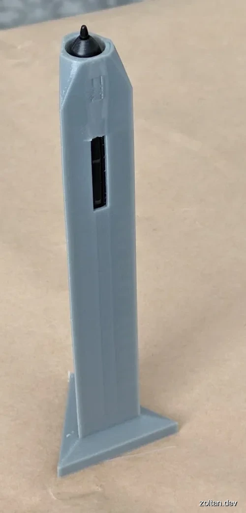 A light gray 3D-printed surround for a digital stylus.